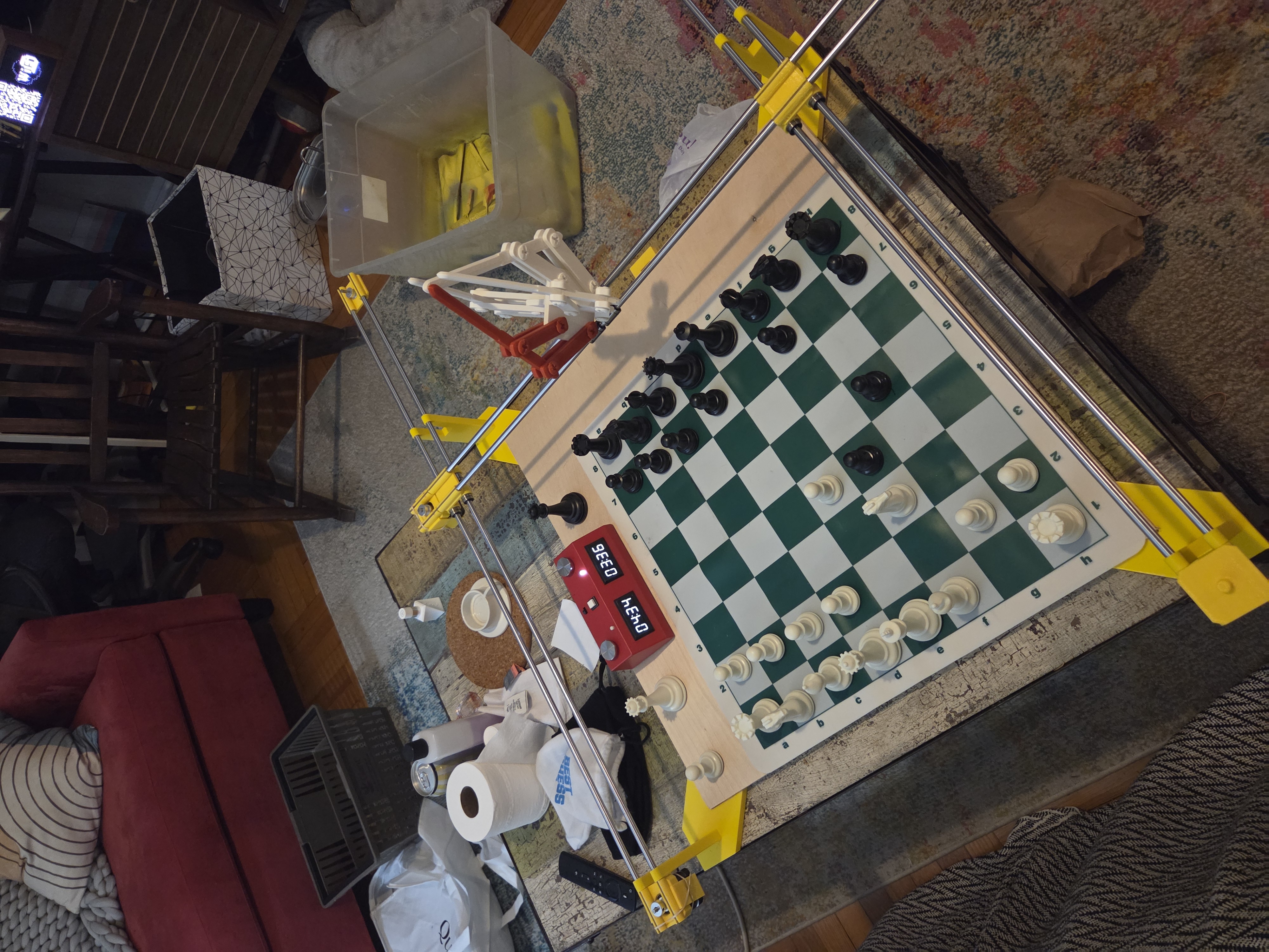 The Chess Robot prototype on my coffee table! (With a stand-in for the end effector I made years ago)